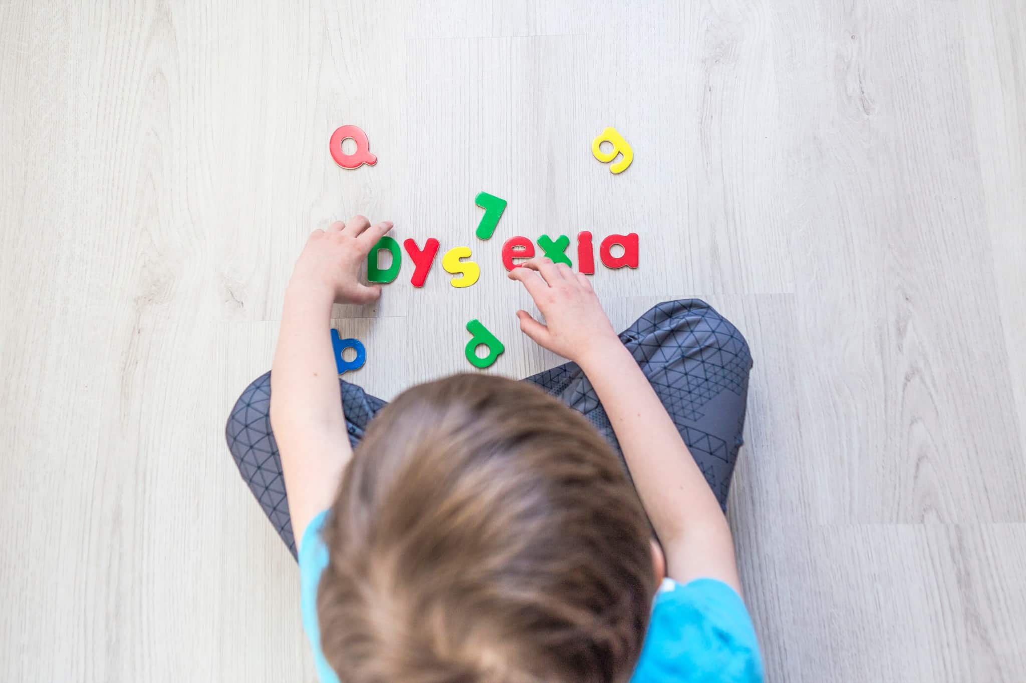 Child with dyslexia organizing letters