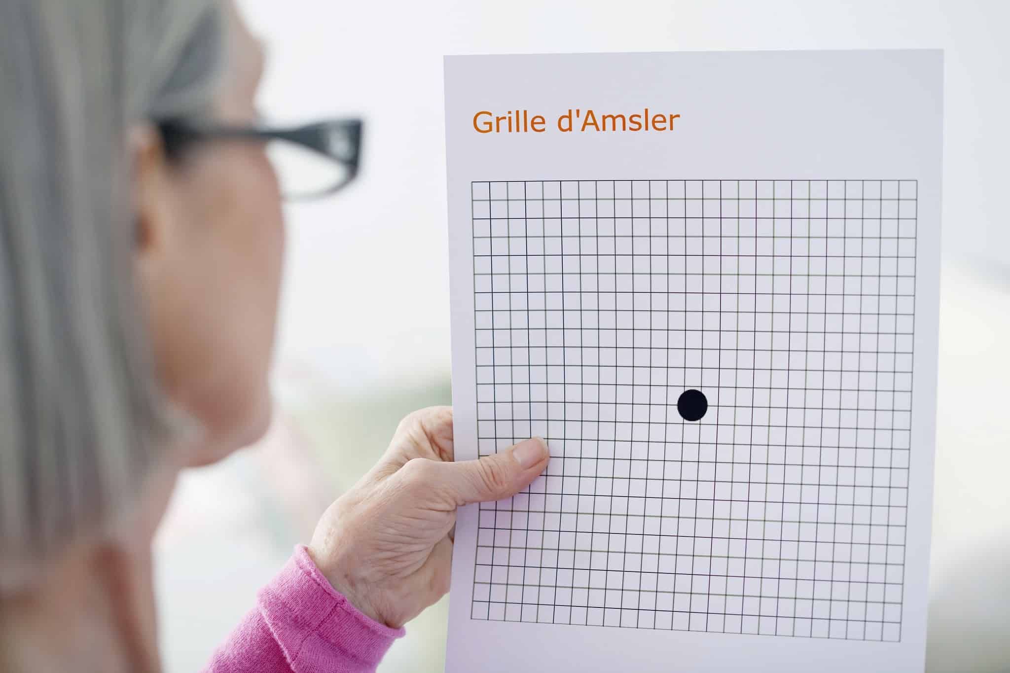 Woman looking at an Amsler Grid