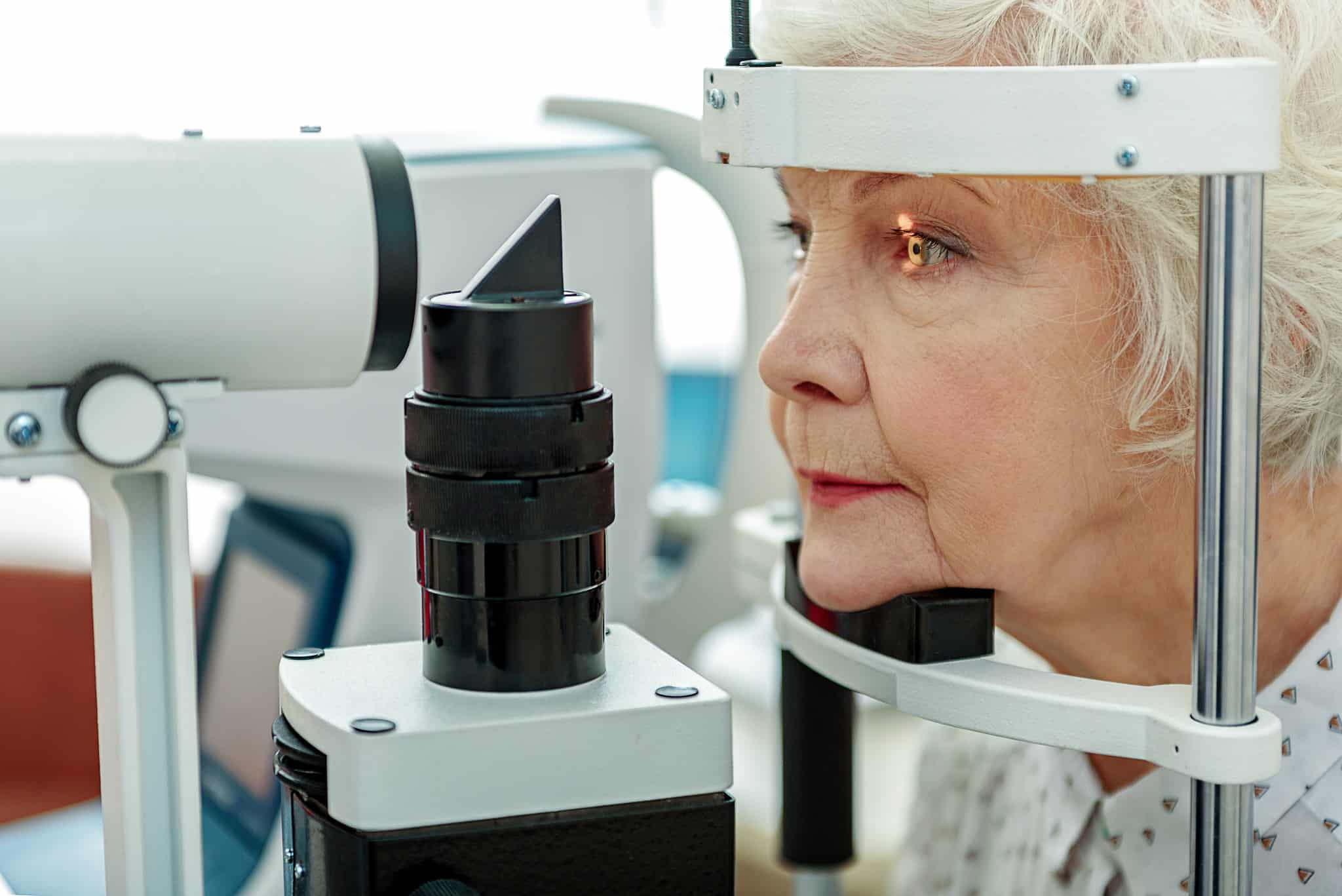 Elderly woman getting an eye exam