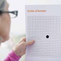 Woman looking at an Amsler Grid